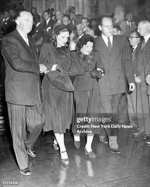 Mrs. Claire Ruth, Babe Ruth's widow is escorted by daughter and son-in-law, Mr. And Mrs. Richard Flanders at St. Patrick's Cathedral. Funeral...