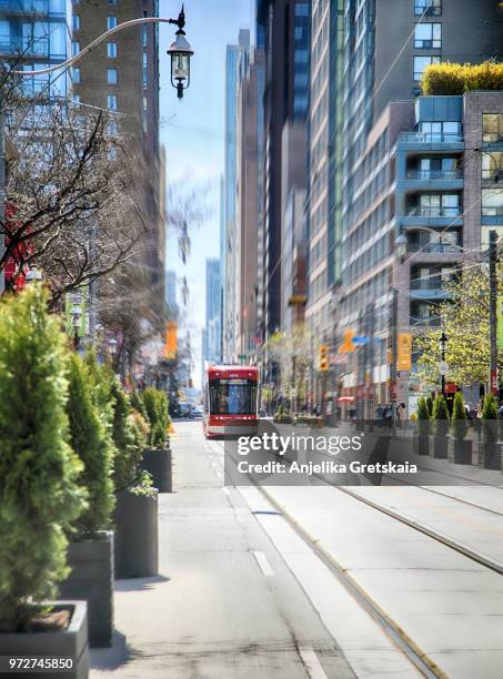 street tram in toronto downtown in motion blur - toronto streets stock pictures, royalty-free photos & images