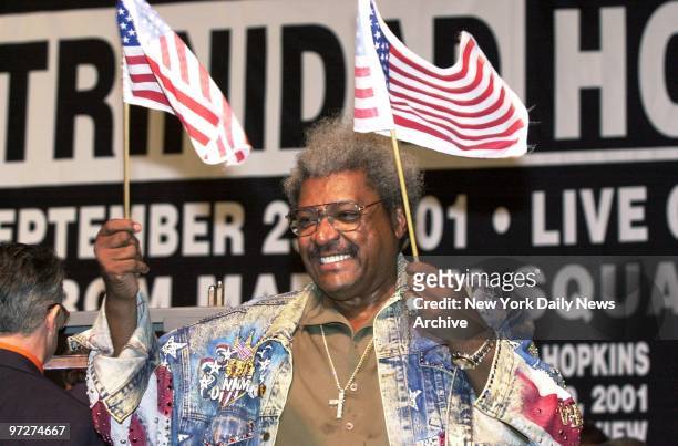 Boxing promoter Don King waves American flags and sports a patriotic jacket at the weigh-in of Bernard Hopkins of Philadelphia and Felix Trinidad of...