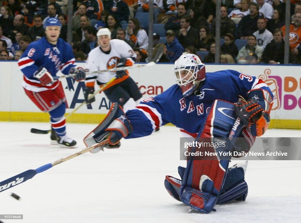New York Rangers' goalie Mike Dunham stops the puck during game... News ...