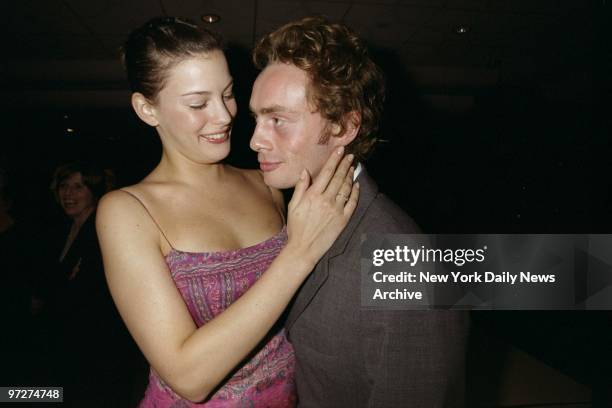 Liv Tyler arrives with her boyfriend, Royston Langdon, singer/bassist in the band Spacehog, for the premiere of the movie "Besieged" at the Warner...