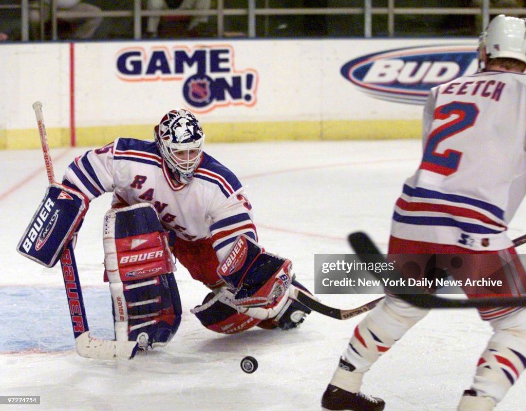 New York Rangers goalie Mike Richter makes a save in game ag
