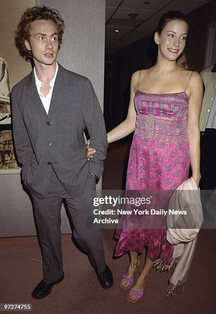 Liv Tyler arrives with her boyfriend, Royston Langdon, singer/bassist in the band Spacehog, for the premiere of the movie "Besieged" at the Warner...