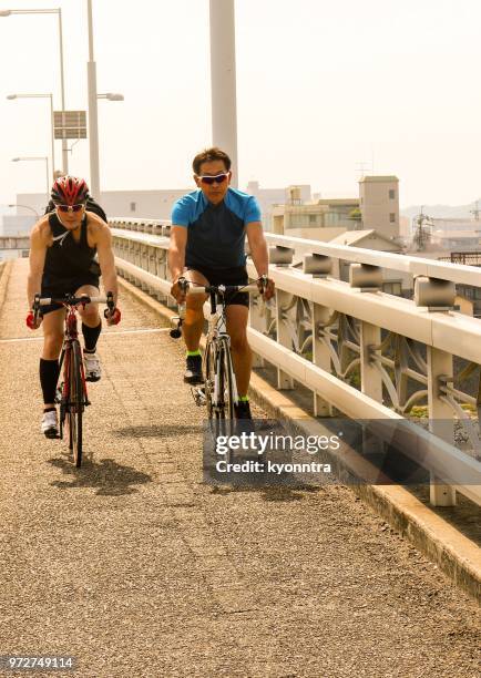 active senior adults are  enjoying cycling - kyonntra stock pictures, royalty-free photos & images