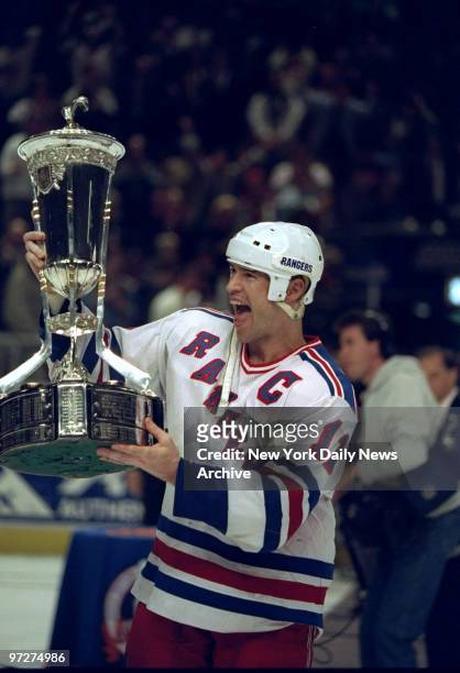 New York Rangers' Mark Messier holds Prince of Wales trophy, the prize awarded to Stanley Cup East Conference hockey champs. The Rangers defeated the...