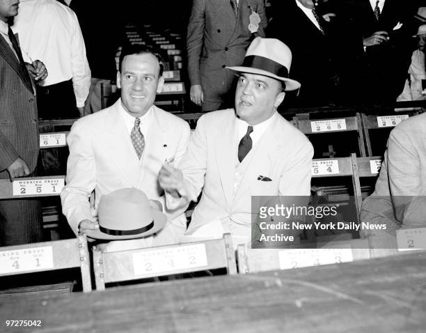 Edgar Hoover and Clyde Tolson attending the Joe Louis - Jack Sharkey fight at Yankee Stadium.