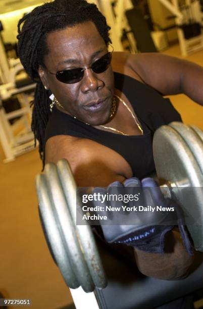 Saxophonist Clarence Clemons, also known as "the Big Man" in Bruce Springsteen's E Street Band, does barbell curls at a gym in the Trump...