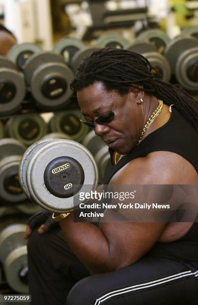 Saxophonist Clarence Clemons, also known as "the Big Man" in Bruce Springsteen's E Street Band, does barbell curls at a gym in the Trump...