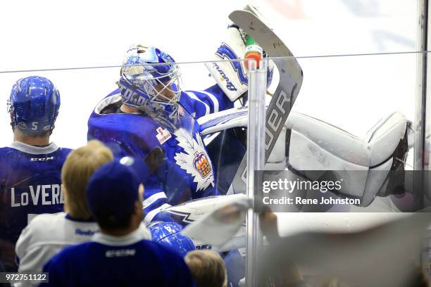 Toronto Marlies goalie Garret Sparks goes over the boards and onto the bench after being pulled against the Texas Stars in Calder Cup action on June...