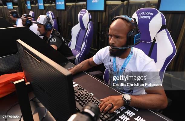 Fighter Demetrious Johnson competes in the Epic Games Fortnite E3 Tournament at the Banc of California Stadium on June 12, 2018 in Los Angeles,...