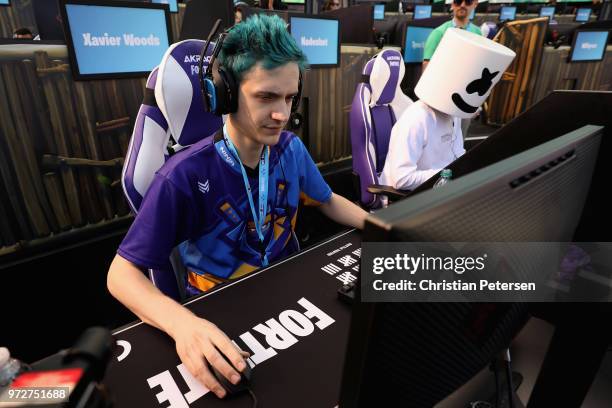 Gamers 'Ninja' and 'Marshmello' compete in the Epic Games Fortnite E3 Tournament at the Banc of California Stadium on June 12, 2018 in Los Angeles,...