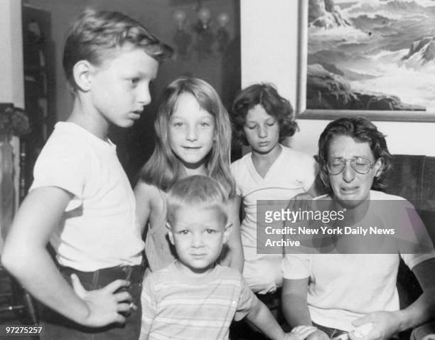 Mrs. Pattie Schaeffer with children Charles, Deseri, Kelly and Eric in their Bronx home after she stabbed her estranged husband to death.