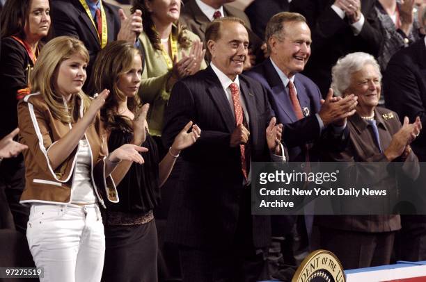 First Daughters Jenna and Barbara Bush; former Sen. Bob Dole; former President George Bush and former First Lady Barbara Bush smile as they listen to...