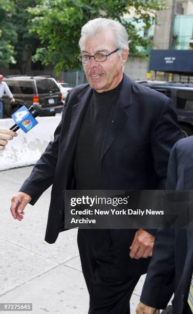 Msgr. John Woolsey arrives at Manhattan Supreme Court for sentencing. The 69-year-old priest, who pleaded guilty to raiding the St. John the Martyr's...
