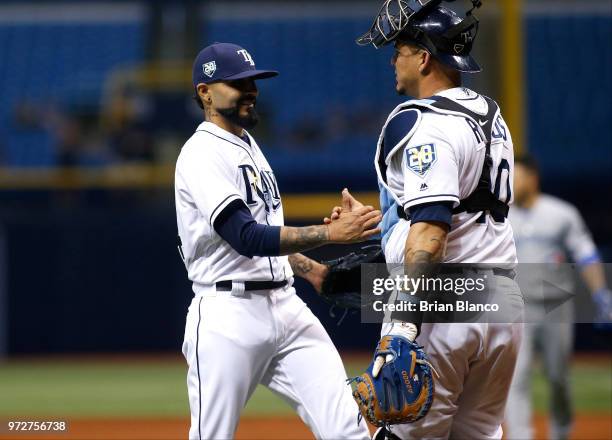 Pitcher Sergio Romo of the Tampa Bay Rays and catcher Wilson Ramos celebrate their 4-1 win over the Toronto Blue Jays at the conclusion of a game on...