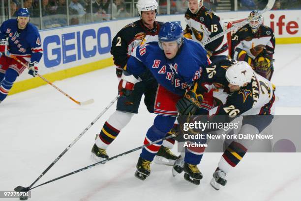 New York Rangers' Jaromir Jagr is pressured by Atlanta Thrashers' Garnet Exelby and Ronald Petrovicky during the third period of a game at Madison...