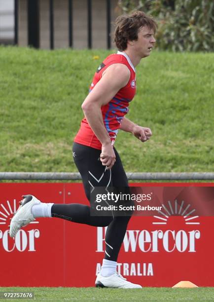 Liam Picken of the Bulldogs runs during a Western Bulldogs AFL training session at Whitten Oval on June 13, 2018 in Melbourne, Australia.