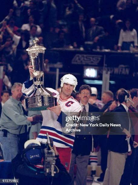 New York Rangers' Mark Messier holds Prince of Wales trophy, the prize awarded to Stanley Cup East Conference hockey champs. The Rangers defeated the...