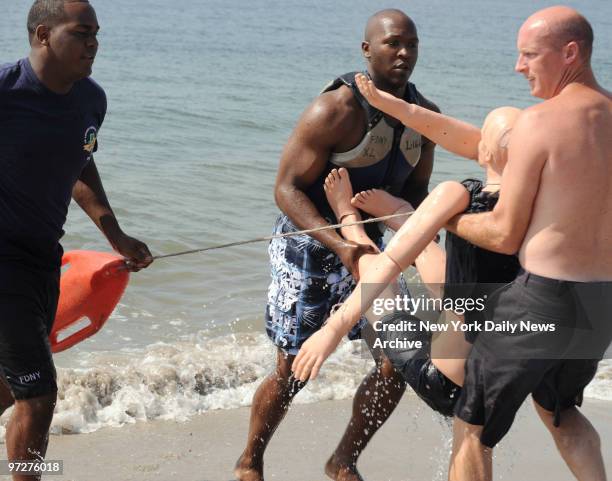 The FDNY Water Rescue Unit practice at Coney Island by pulling a lifesize mannequin from the ocean. New York Daily News reporter Simone Weichselbaum...
