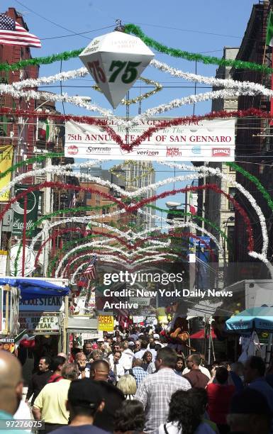 Mulberry St. Is crowded with people out to enjoy the 75th annual Feast of San Gennaro. The 11-day celebration in Little Italy features food, drink,...