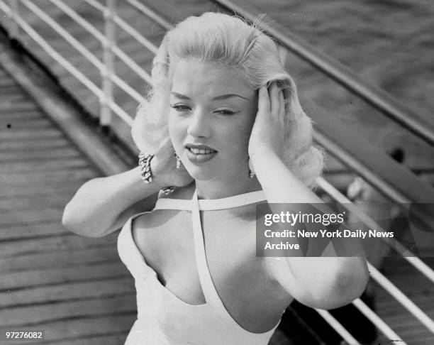 British actress Diana Dors arriving at Hudson River Pier 50 aboard the Queen Elizabeth.