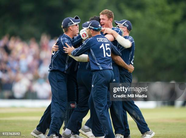 Scotland players go wild after beating England by 6 wickets in the one-off ODI at the Grange Cricket Club on June 10, 2018 in Edinburgh, Scotland.