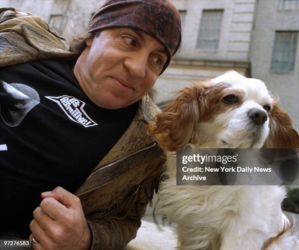 Musician turned actor Steve Van Zandt and his dog, Jake, take a breather while strolling along W. 57th St.