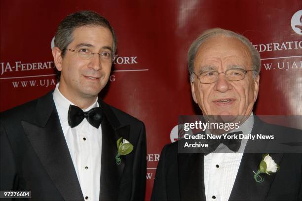 Brian Roberts, CEO of Comcast , and Rupert Murdoch are at the Waldorf-Astoria for the UJA-Federation of New York's Ross Dinner. Roberts was honored...