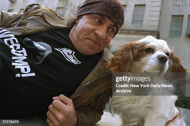 Musician-actor Steve Van Zandt and his dog, Jake, take a breather while strolling along W. 57th St.