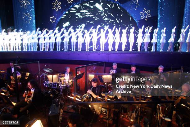 Musicians are in the orchestra pit as live music returns to Radio City Music Hall for today's 2:30 performance of the "Christmas Spectacular," the...