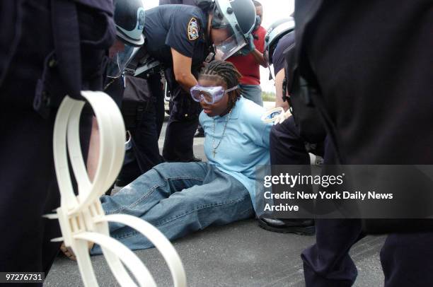 Cops arrest a "protester" during training exercises at Floyd Bennett Field in Brooklyn. Police tested hand-held radiation detectors and reinforced...