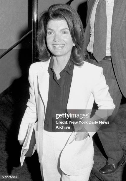 Jacqueline Kennedy Onassis is all aglow at the theater. It may be because the performance was benefiting one of her pet philanthropies, the East...