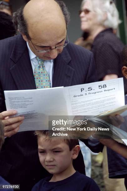 Schools Chancellor Joel Klein checks report cards on the last day of classes at Public School 58 in Carroll Gardens, Brooklyn.
