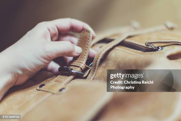 hand opening leather rucksack - open rucksack stock pictures, royalty-free photos & images