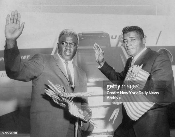 Jackie Robinson and Floyd Patterson prepare to board plane to Birmingham.