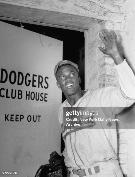 American baseball player Jackie Robinson enters the Brooklyn Dodgers club house as the first black man admitted to the majors, Brooklyn, New York,...