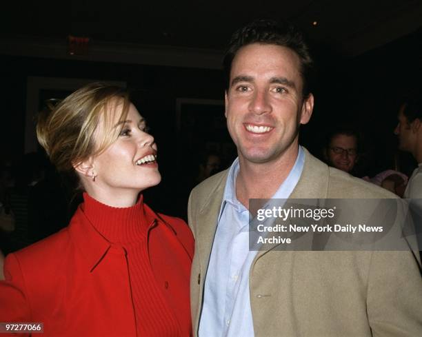 Long Island TV reporter Trish Bergin smiles at boyfriend Sean Kenniff, formerly of TV's "Survivor," during the Abercrombie & Fitch catalog party at...