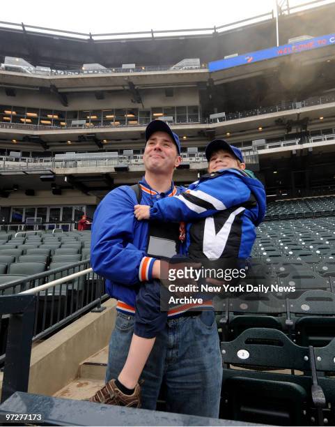 Corey Okeefe and son Corey Jr. Take in the new stadium as St. Johns players get ready to take on Georgetown at the first game held at Citi Field, the...