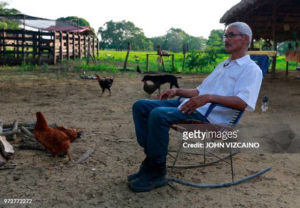 Jose Alarcon rests in his farm in Cedro Cocido, near Leticia in rural Monteria, Cordoba Department, northern Colombia, on June 7, 2018. - Alarcon...