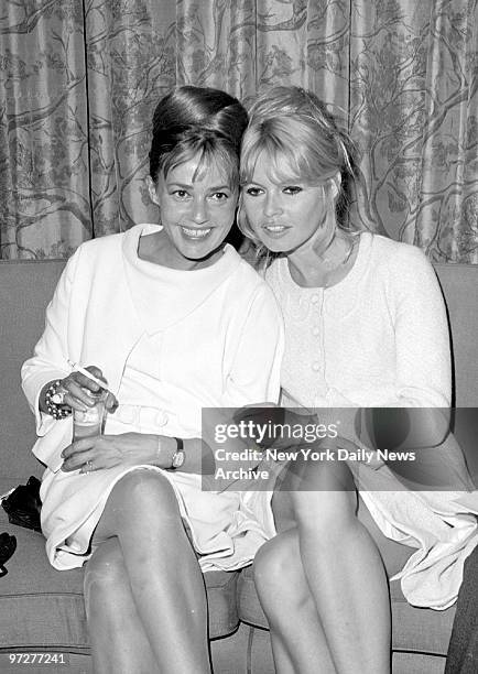 Brigitte Bardot with Jeanne Moreau in the Air France lounge at Kennedy Airport.