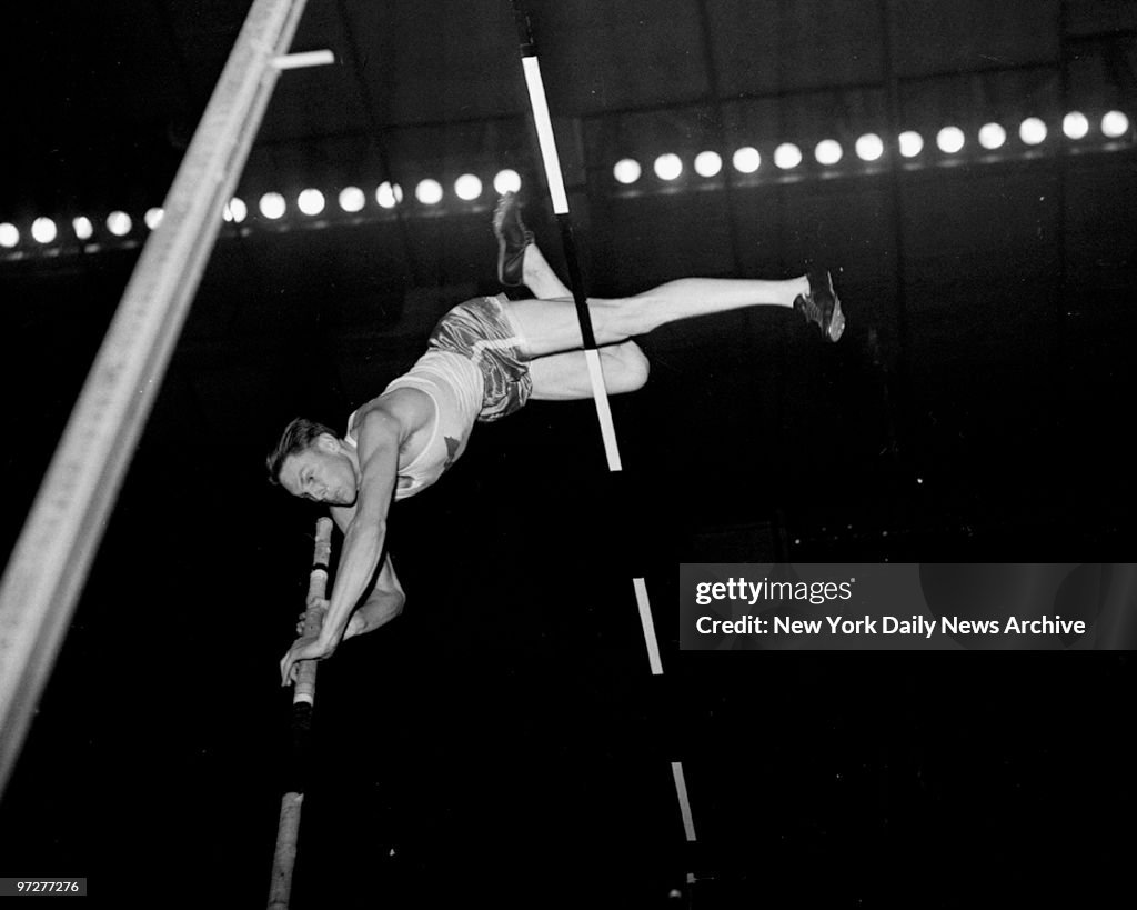 Cornelius Warmerdam sets a new world indoor pole vault recor