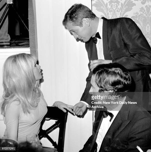 Brigitte Bardot and Paul Newman at a party for Bardot at the Beverly Hills Hotel.
