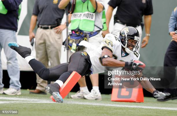 Jacksonville Jaguars' wide receiver Jimmy Smith keeps his right foot inbounds at the end zone to score the winning touchdown in overtime against the...