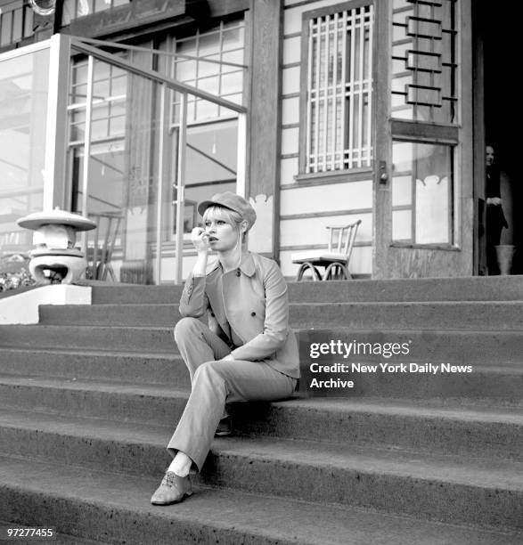 Brigitte Bardot waiting for her car at the Beverly Hills Hotel.