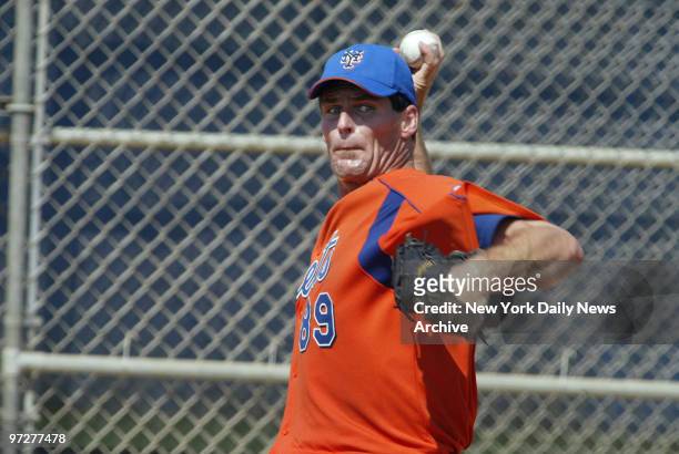 Scott Erickson warms up his pitching arm at the New York Mets' spring training camp in Port St. Lucie, Fla. Erickson, who signed a minor league...