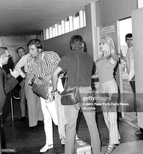 Brigitte Bardot with her husband, Gunther Sachs von Opel, arriving at Kennedy Airport.