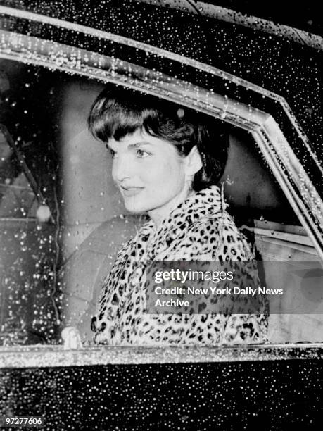 Jacqueline Kennedy in her limousine outside the Carlyle Hotel.