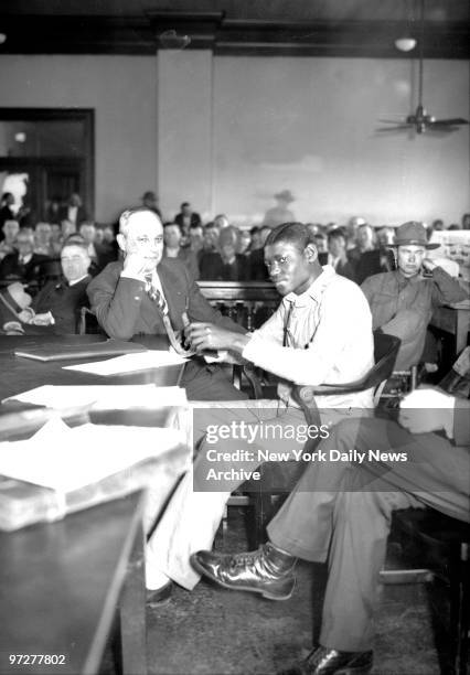 Scottsboro Case - Before the amused gaze of his attornye, Samuel Leibowitz, Haywood Patterson, first of the seven defendants to face court in retrial...