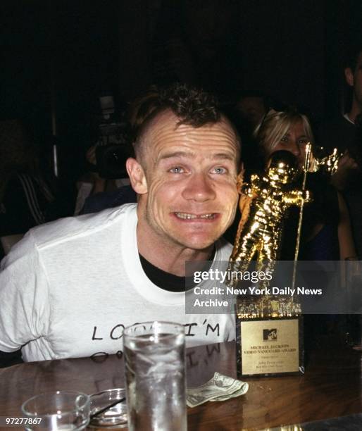 Flea of Red Hot Chili Peppers at a Jane magazine party following the MTV Video Music Awards at Club Rhone. That's his award on the bar, which may...