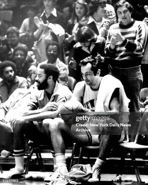 Knicks Bill Bradley [right] reflects on ending of career alongside teammate Walt Frazier during game against Indiana Pacers.